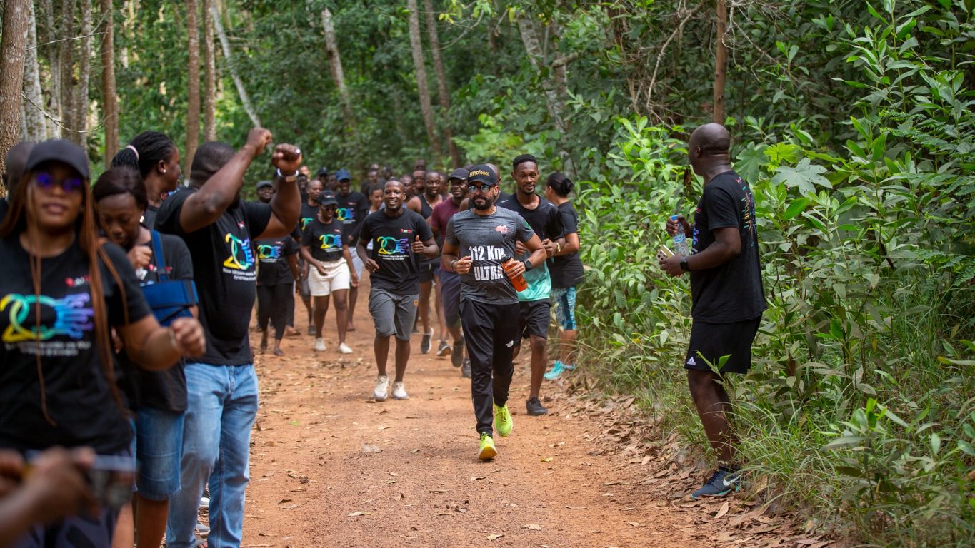 AITEK employees taking part in a group run outdoors.