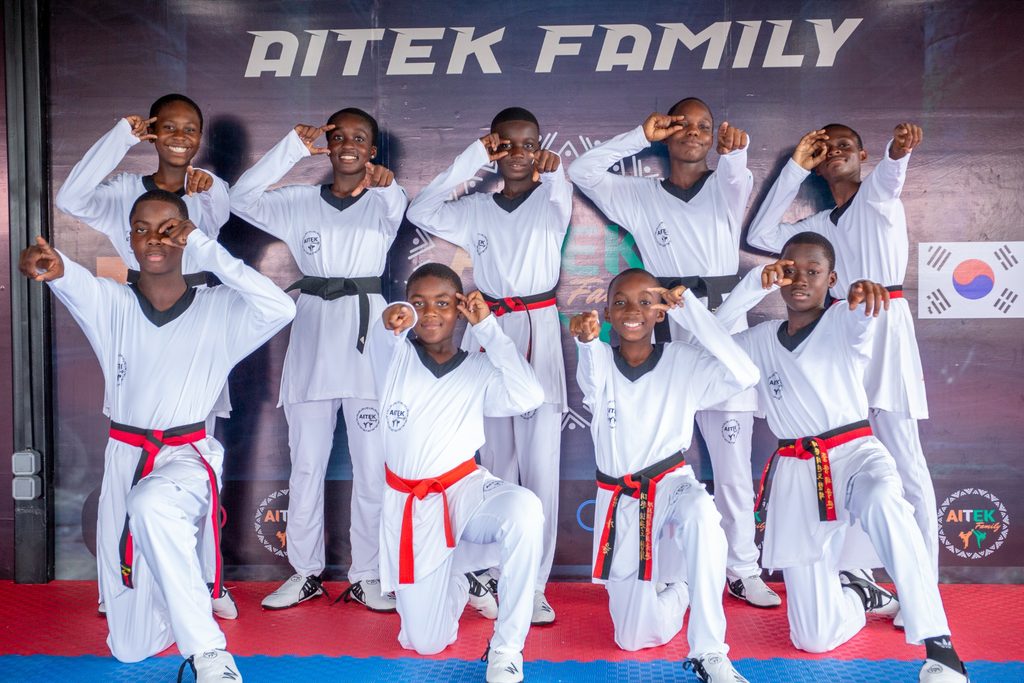 Children from the AITEK Family taekwondo club in training uniform.
