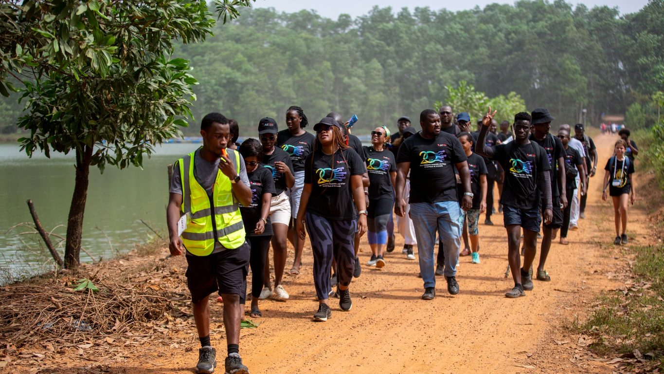 AITEK employees on a group walk by the water.